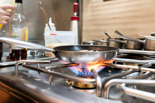 Professional chefs in action inside a busy restaurant kitchen