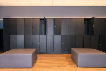 Empty gym locker room with modern benches