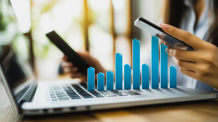 Businesswoman using smartphone and laptop to view innovation reports, digital graphs, analyze market changes and investments during holidays.

