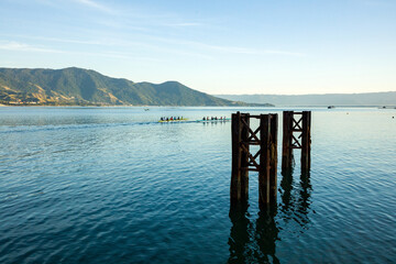 Boats on the coast of Sao Paulo on a beach in Ilhabela island in the sand with grass, boat highlighted in Brazil coast
