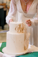 Elegant Wedding Cake with Floral Accents and Monogram