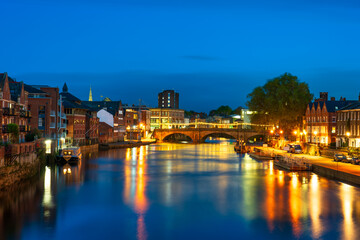 Skyline view of York city canal at blue hour. England