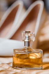 Elegant Bridal Still Life Featuring Perfume and Wedding Ring