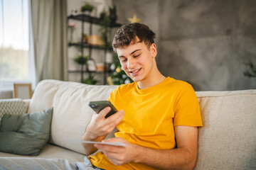 Adult young man have contactleess payment on mobile phone at home