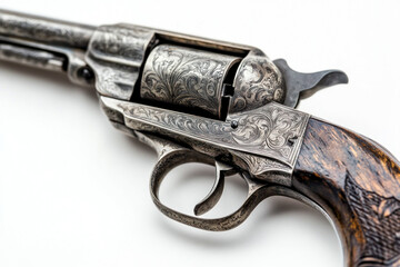 Revolver with intricate engraving on the side, set against a dark background.