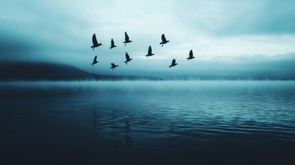 Obraz premium Birds Flock Taking Off from Misty Twilight Lake