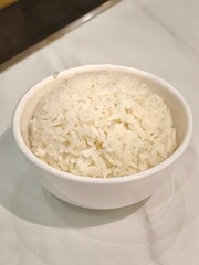 Cooked rice in ceramic bowl. Food menu concept