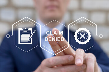 Man using virtual touch screen presses inscription: CLAIM DENIED. Claim Denied Compensation...