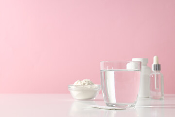 Collagen powder with a glass of water