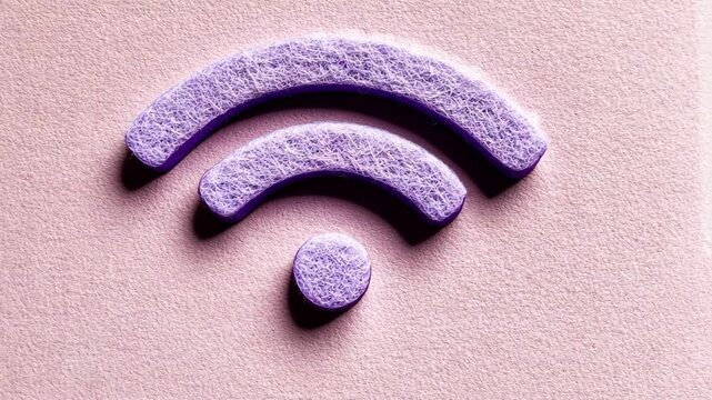 A close-up of a purple Wi-Fi symbol on a pink surface
