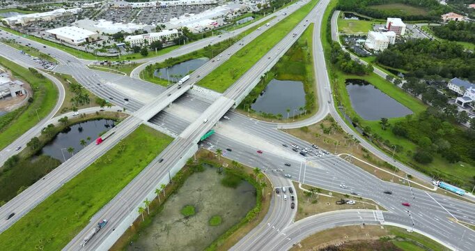 American highway bridge with fast moving traffic at diverging diamond interchange. Transportation infrastructure in Sarasota, Florida.