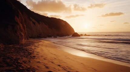 Golden sunset over a secluded beach with cliffs in the background.