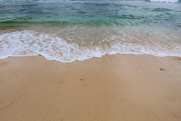 View of the waves washing the beach