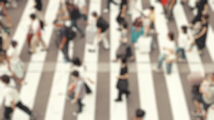 Many pedestrians crossing on the road, Umeda in Osaka in Japan, Business or people, Blurred, 4K slow motion	