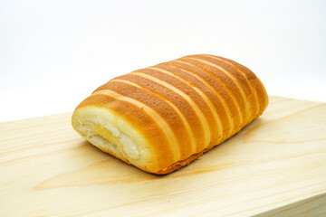 Bread rolls on a cutting board isolated on a white background