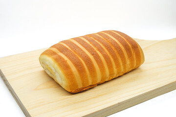 Bread rolls on a cutting board isolated on a white background