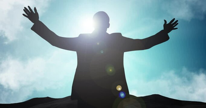 Worship, praying and silhouette of person on mountain for spiritual healing, faith or surrender to God. Christianity, shadow or forgiveness on hill for gratitude, praise to Jesus or guidance with sky