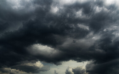 Obraz premium Cloud storm sky dark halloween background rain lightning thunder stoumy typhoon Nature light scene rainy atmosphere damage effect carbon dioxide dust air pollution 2.5 Pm, texture nature windstorm.