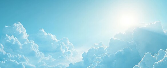A panoramic view of a bright blue sky with fluffy white clouds.