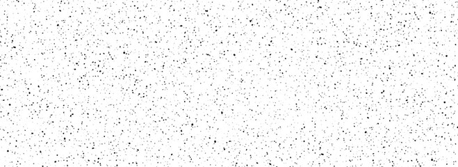 Obraz premium Dirty dotted seamless pattern. Black and white grunge sprinkles, particles, dust and splashes wallpaper. Distress noise grain repeating background. Random splattered gritty overlay texture. Vector