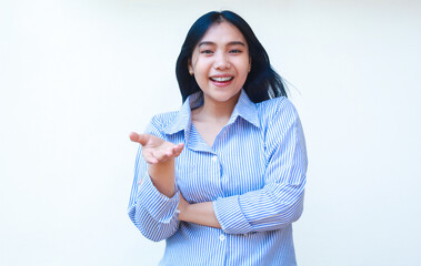 happy asian woman wear striped shirt raising arm with inviting gesture isolated on white background