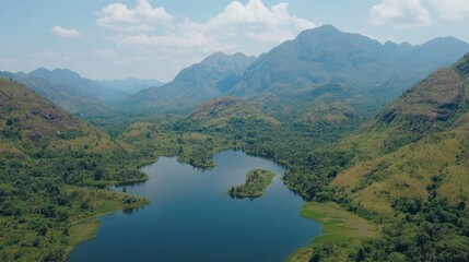 Obraz premium Serene Aerial View of Green Mountains and Calm Lake