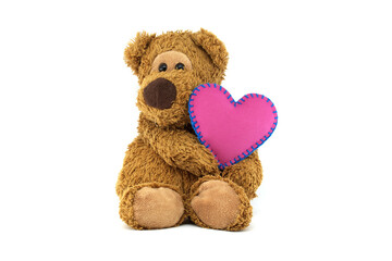 Teddy bear holding pink heart with blue stitching, expressing love and warmth on a white background