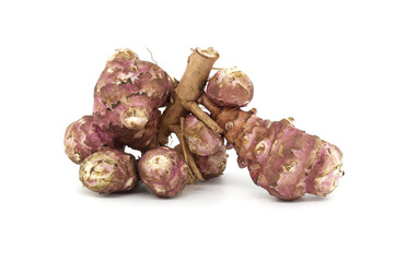 Fresh raw Jerusalem artichokes isolated against a white background