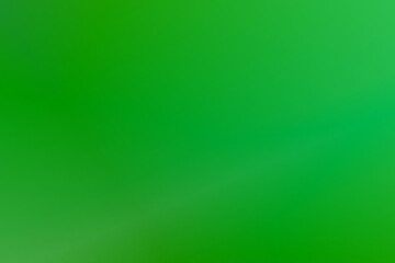 Fototapeta premium Abstract blurred fresh green background Pastel light green foil gradient shimmer background texture. glossy yellowish green, fiery green foil, Color gradient, ombre