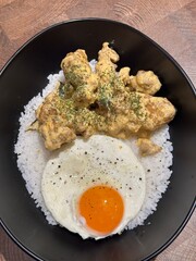 Crispy Chicken with Salted Egg Yolk Sauce. Made from bite-sized chicken fillets, wrapped in flour, fried, covered with salted egg yolk seasoning with spices