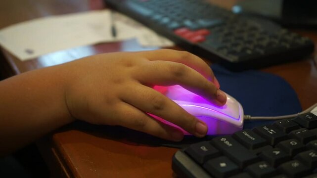 close up of hand playing computer mouse