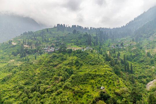 Small villages and colorful local houses nested in the hills of Parvati valley at manikaran, himachal pradesh, India.