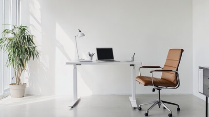A minimalist office setup with a standing desk, ergonomic chair, and just a few essential items like a laptop and notebook, set against a blank white wall