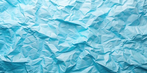 Obraz premium Light blue crumpled paper texture background with a tilted angle