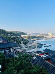 Busan, SOUTH KOREA - January 27, 2024: Haedong Yonggungsa Temple on the edge of a cliff overlooking...