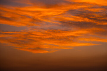 Enjoy a panoramic view of the skyline. The sun rises in the morning sky with colorful clouds. and beautiful cloud patterns In the soft light of the morning
