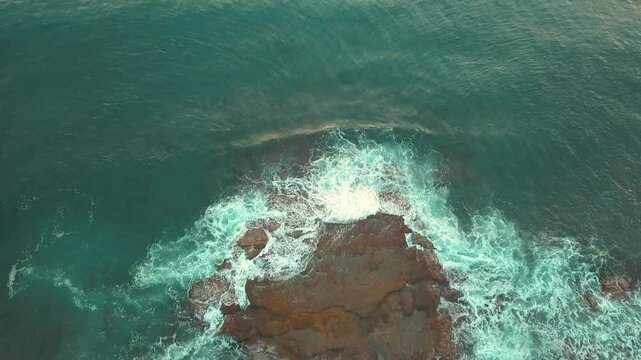 Aerial View of Waves Crashing Against the Shore at Koru Beach in Gazipasa, Turkey, Captured in Soft Sunset Light, Serene Coastal Scene in the Mediterranean