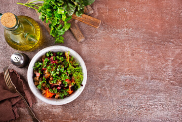 Beet salad in bowl over light stone background. Healthy detox salad with beetroot