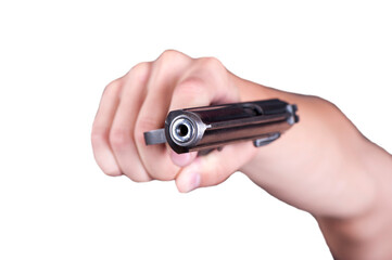 A close-up view of a hand gripping a handgun in a tense and dramatic moment