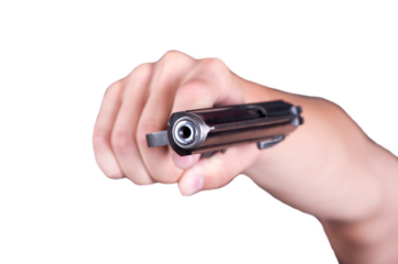 A close-up view of a hand gripping a handgun in a tense and dramatic moment