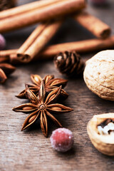 Star anise with cinnamon. Christmas spices on rustic wooden background. Close up.	