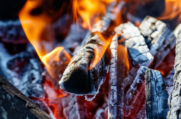 A pile of wood that is on fire