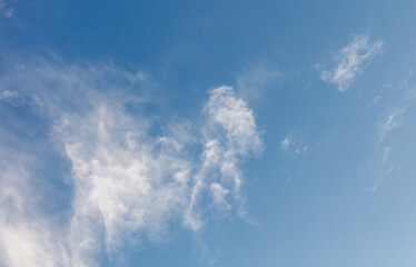 The sky is blue and clear with a few clouds scattered throughout
