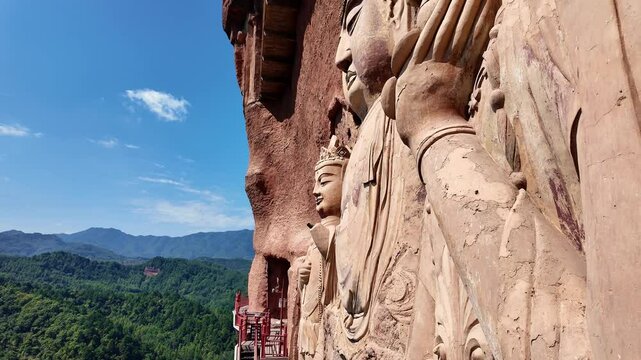 Tianshui, China: Tilt up footage of the famous Maijishan grottoes and its buddhist statues in Gansu province in China. It was an important stop on the silk road. 