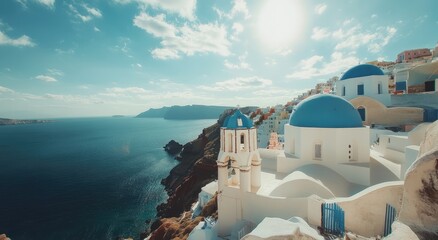 Fototapeta premium A panoramic view of Santorini, Greece, with white buildings and blue domes overlooking the sea, showing the colorful houses on cliffs above azure waters