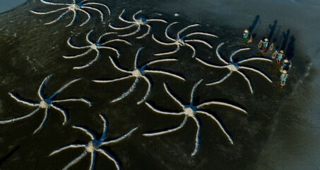 Salt making from sea water in Vietnam is completely handmade. Photo taken in Khanh Hoa on August...
