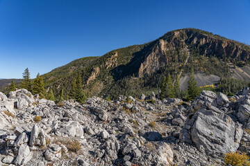 Silver Gate, that formed when travertine from Terrace Mountain collapsed in a landslide. calcium-carbonate rocks. Yellowstone National Park, Wyoming