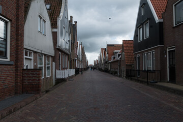 Walking on empty Zuideinde during slow afternoon in Volendam