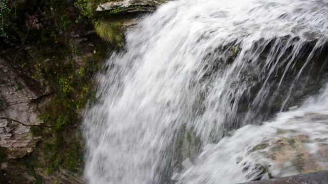 pure and clear water flows from mountain waterfalls