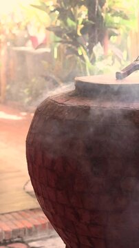 A stone brick tandoor oven in a luxurious restaurant for roasting meat and fish in the tandoori style.